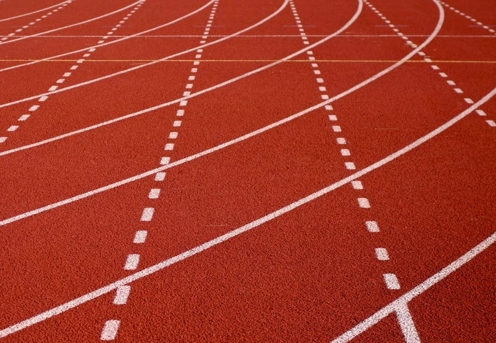 Athletics stadium empty track lanes aerial view