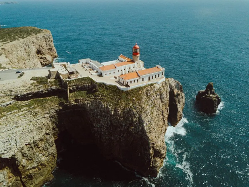 A rocky cape and lighthouse on the Portuguese coast