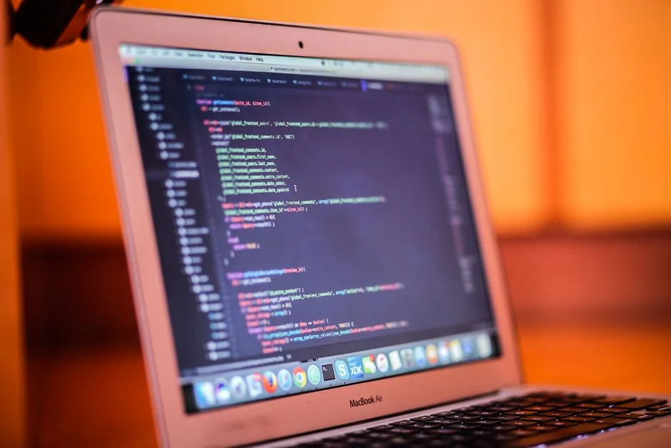 laptop screen displaying lines of code