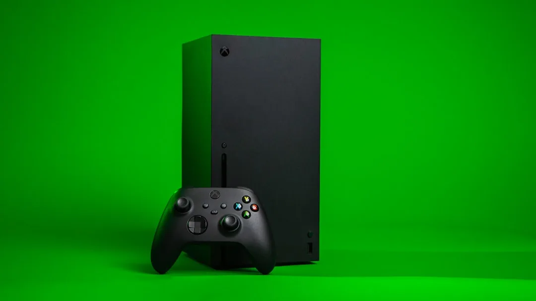 black Xbox One console with controller