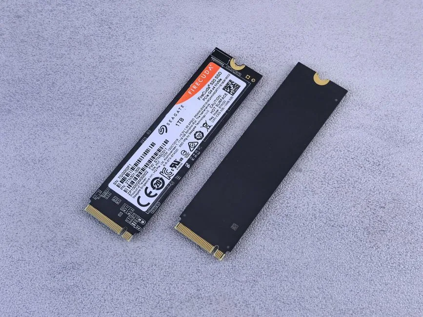two NVMe SSDs on a gray background