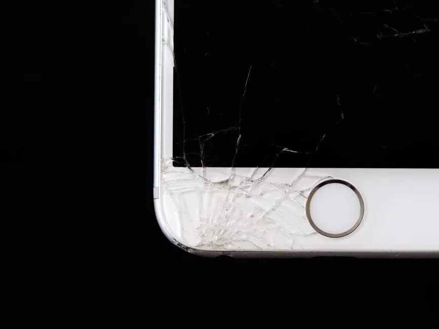 detailed cracked smartphone screen showing damage