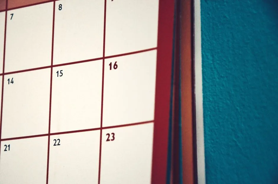 Minimalist calendar hanging on a colorful wall