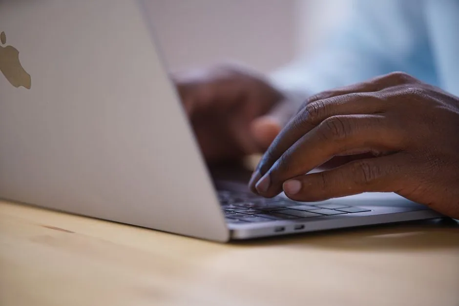 typing on a laptop keyboard