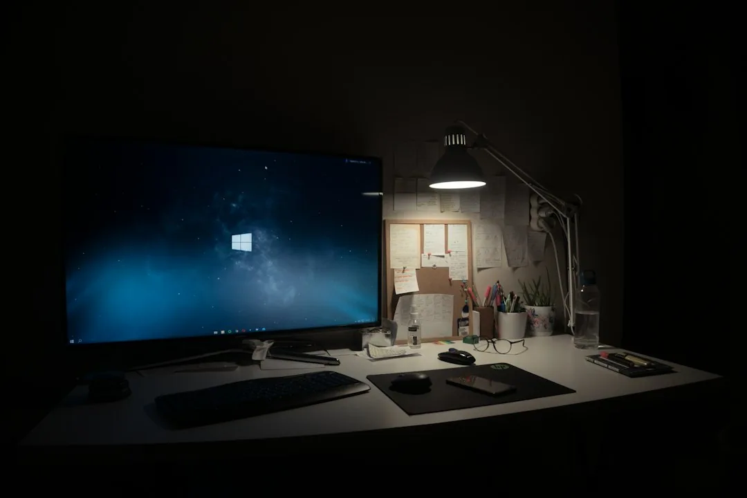 Black flat screen computer monitor on a white desk